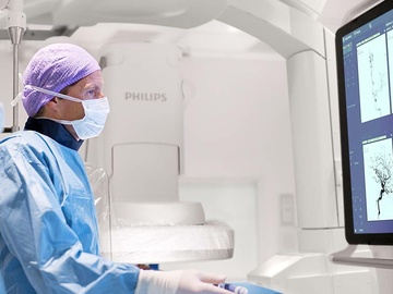 An interventional physician assesses a stroke patient on the Philips Azurion image-guided therapy platform